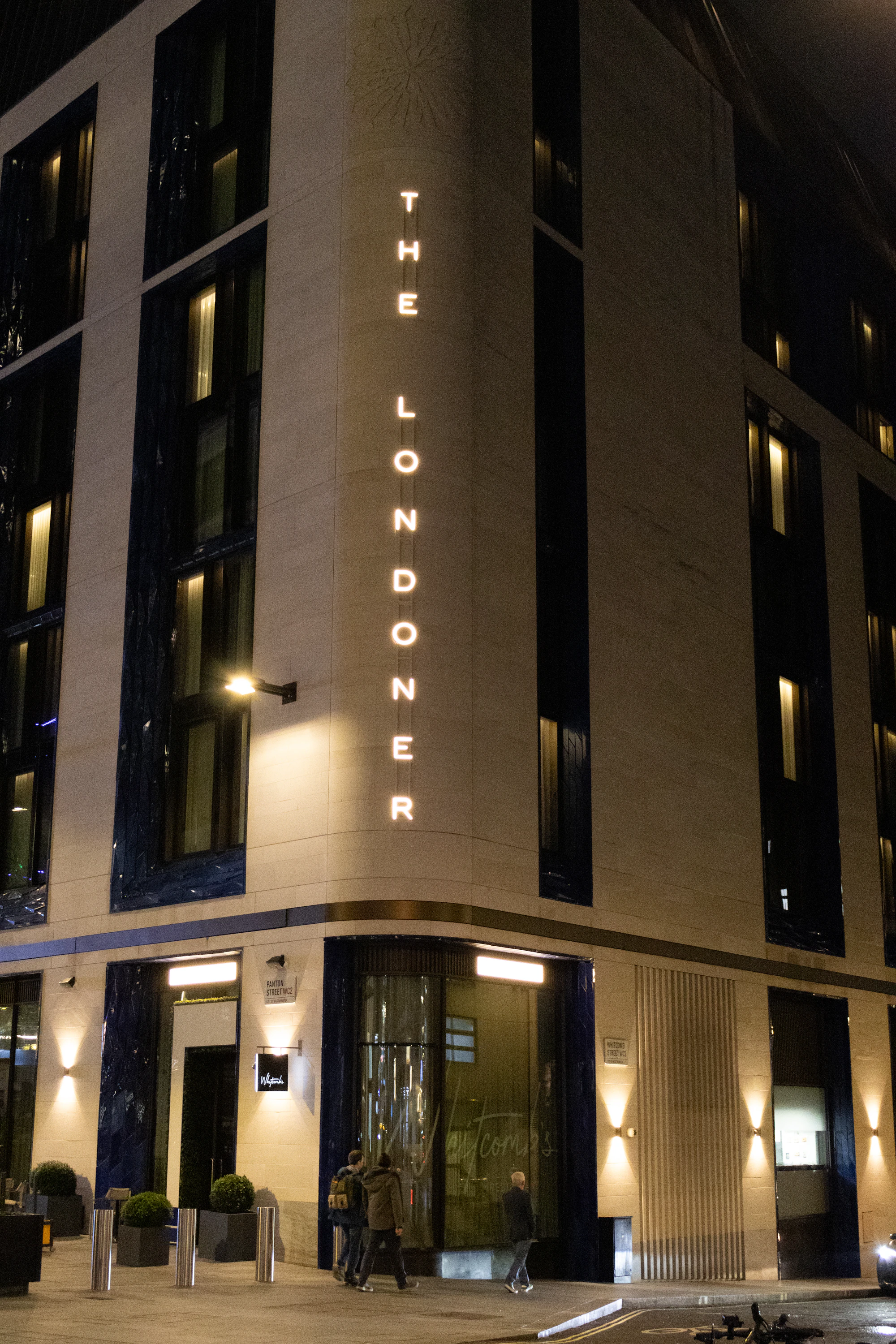 The Spin Suite entrance illuminated at night