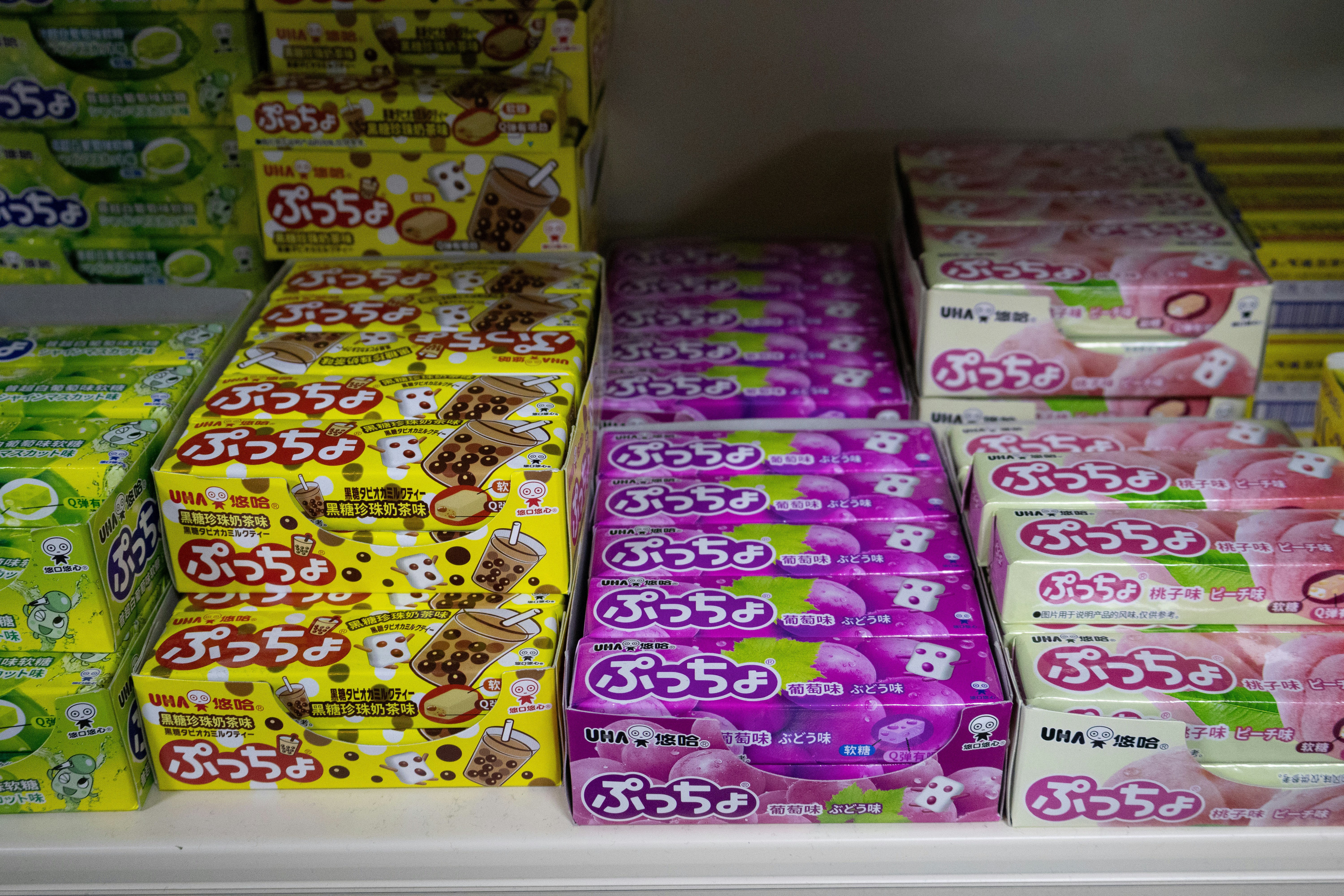 Boxes of assorted candies on shelves