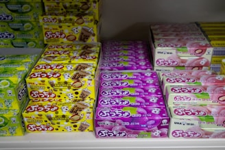 Boxes of assorted candies on shelves