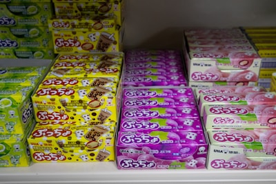 Boxes of assorted candies on shelves