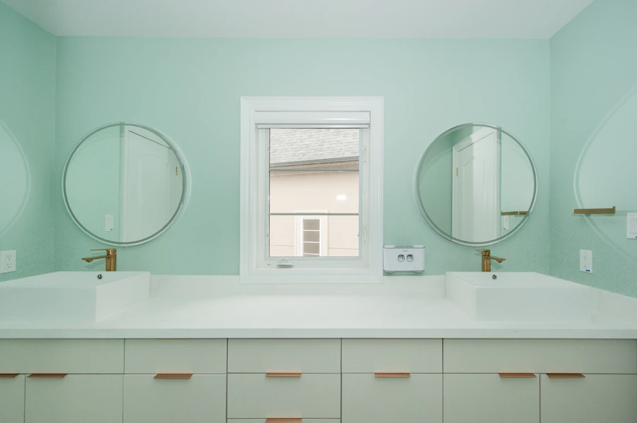 Modern bathroom with a double vanity and mint green walls