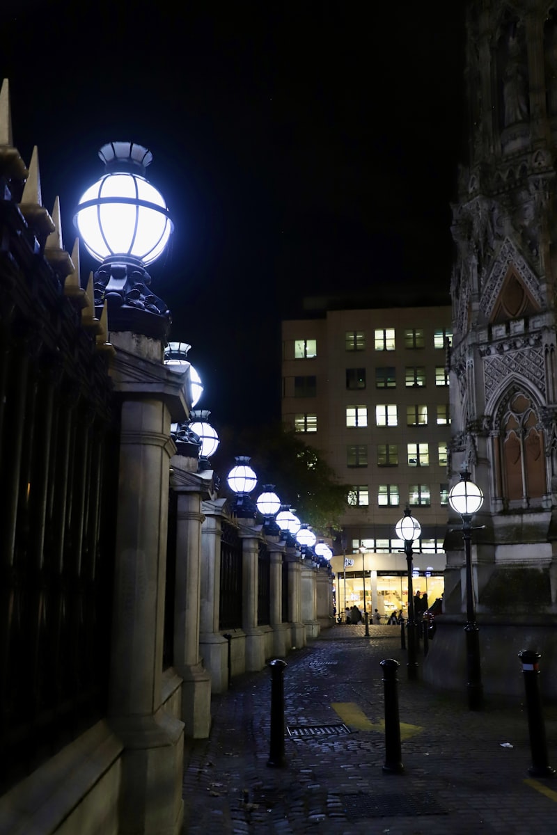 Foggy atmospheric London street at dusk with gas lamps