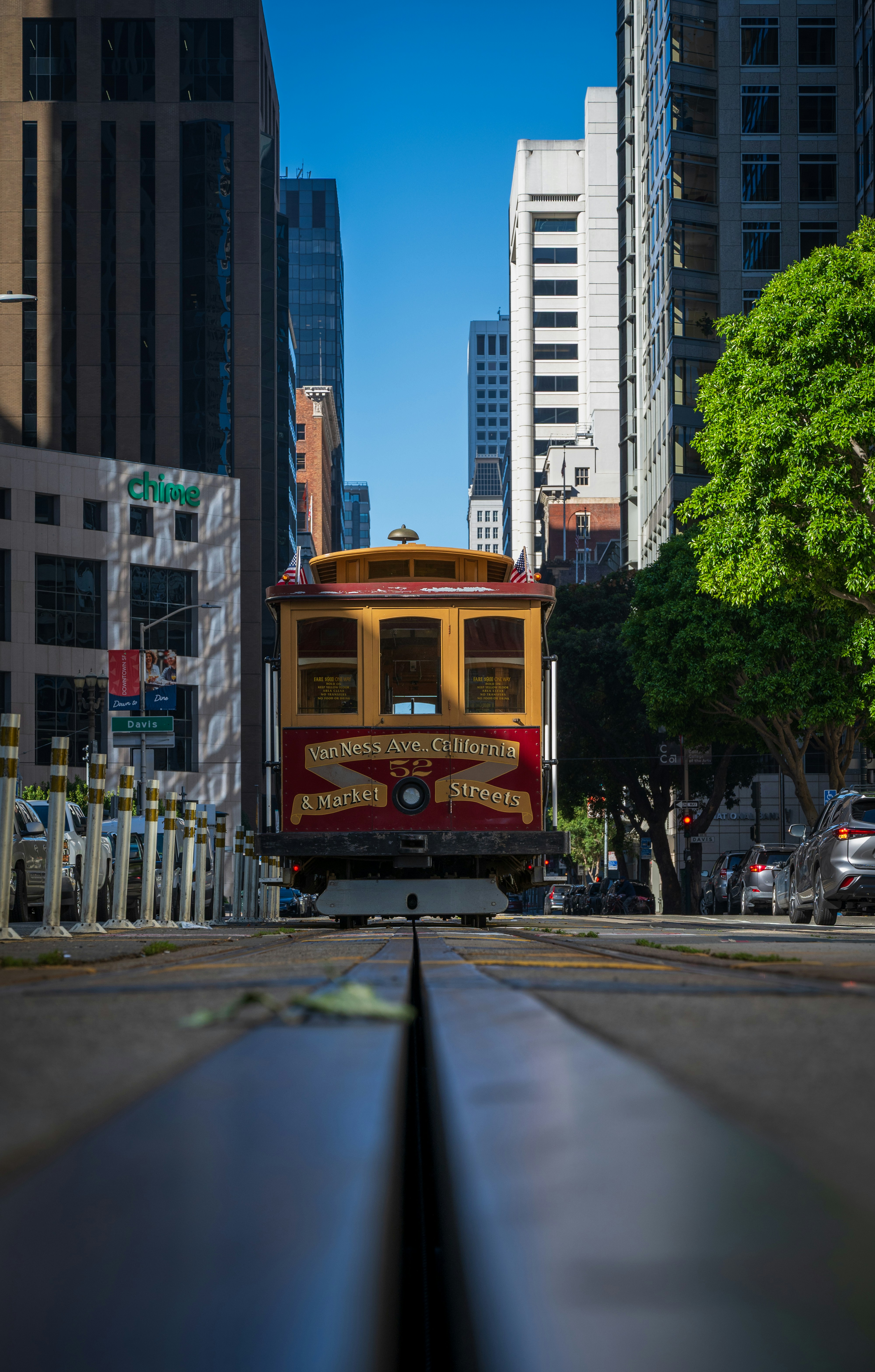 A san francisco cable car on a city street.