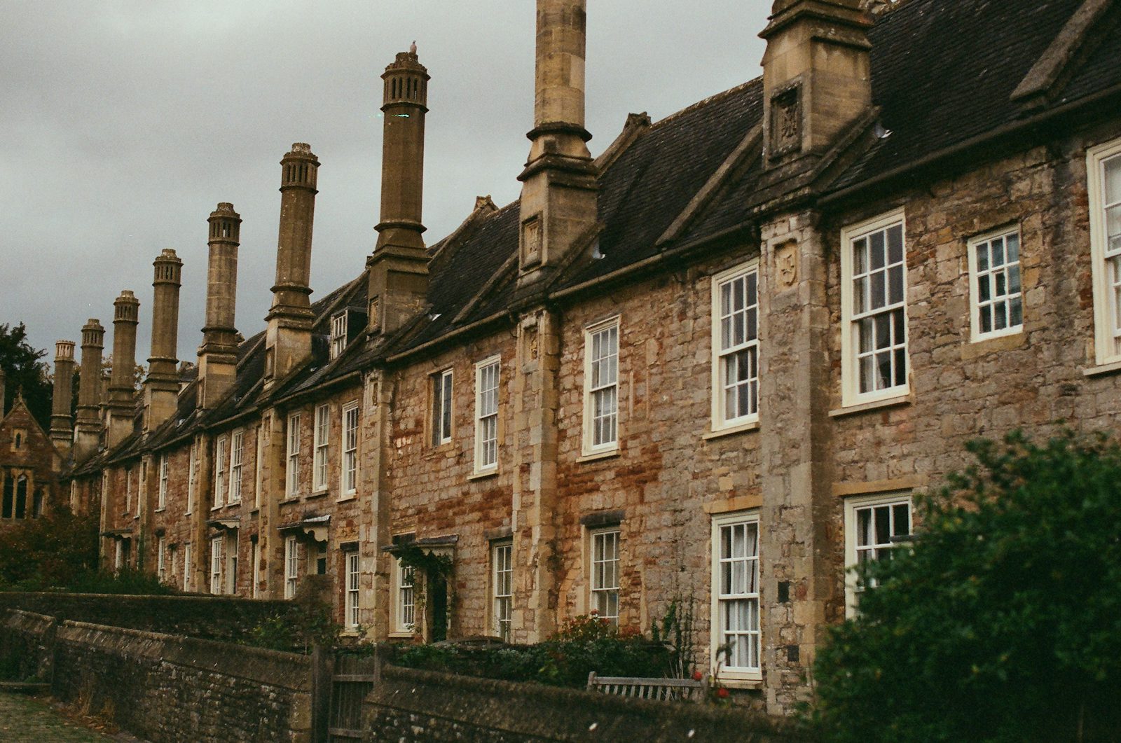 Stone houses with tall brick chimneys