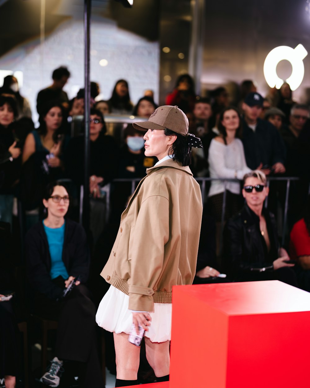 Fashion model backstage at runway show in dramatic styling