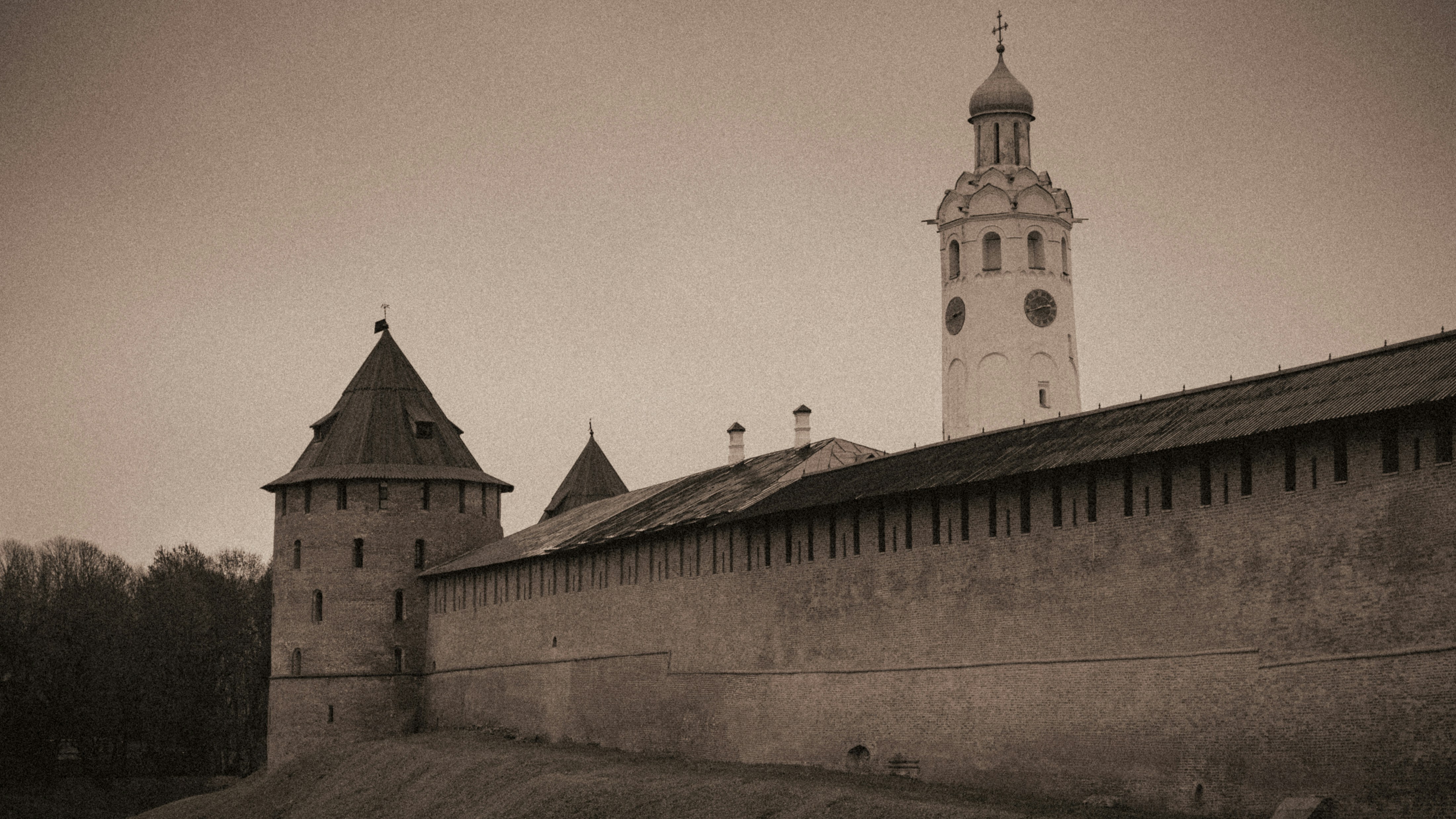 Ancient fortress walls and tower under a cloudy sky