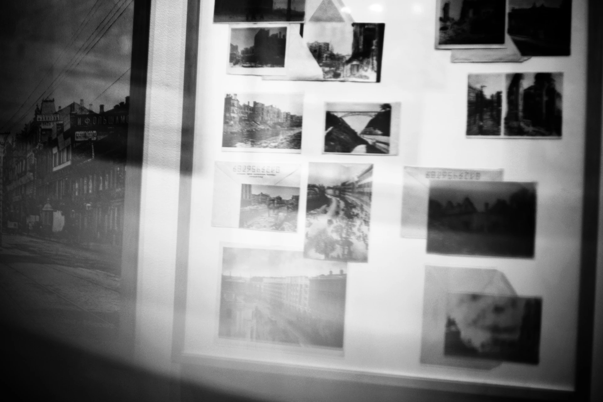 Collection of black and white photographs displayed