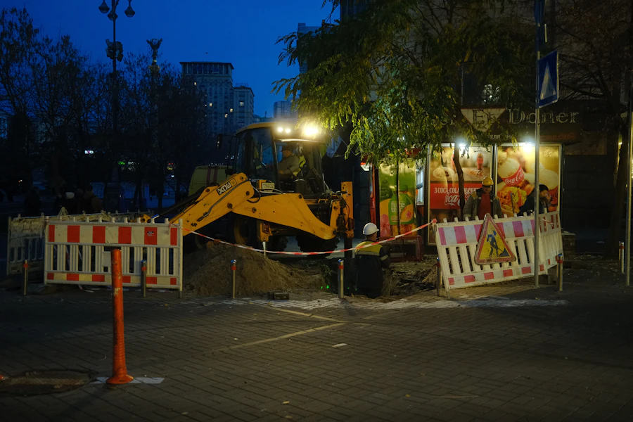 Excavator on a night works site