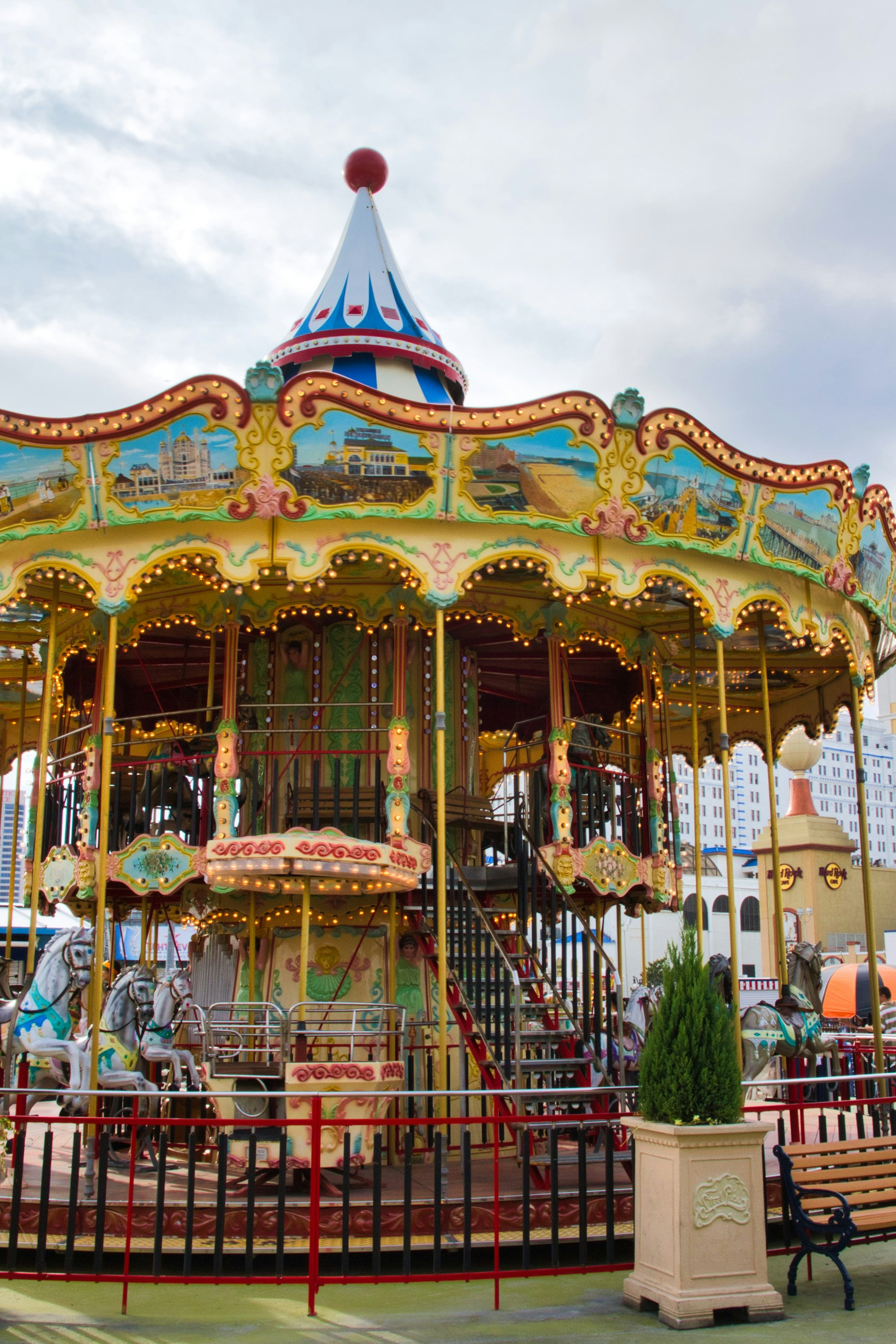 A colorful carousel with ornate details and lights