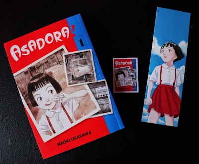 Asadora! manga volume with bookmark and sticker