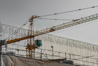 Construction crane against a cloudy sky