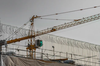 Construction crane against a cloudy sky