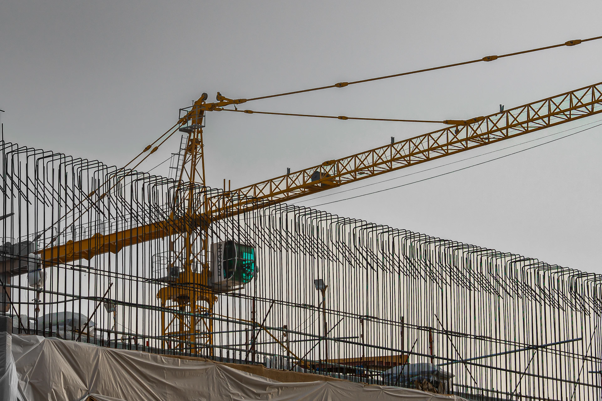Construction crane against a cloudy sky