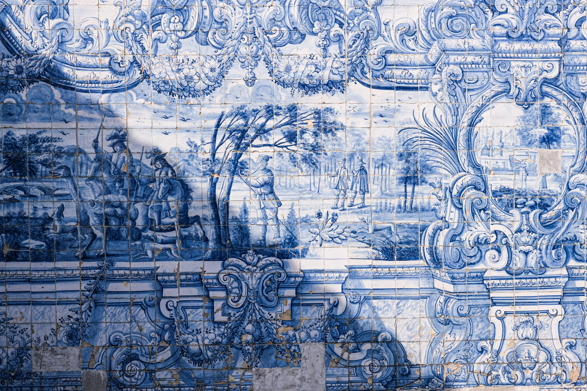 Blue and white tiled wall with ornate patterns