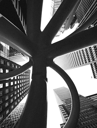 Abstract sculpture with skyscrapers in background