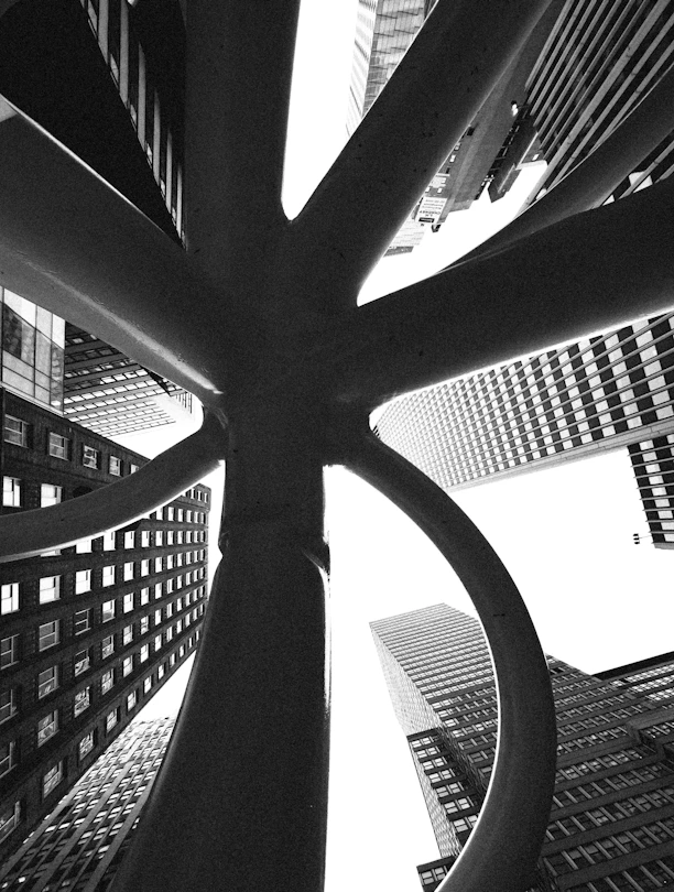 Abstract sculpture with skyscrapers in background