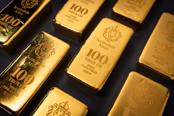 Gold bars arranged in a precise pattern, reflecting the standardized nature of bullion investment