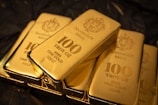 Stack of 100 troy ounce fine gold bars