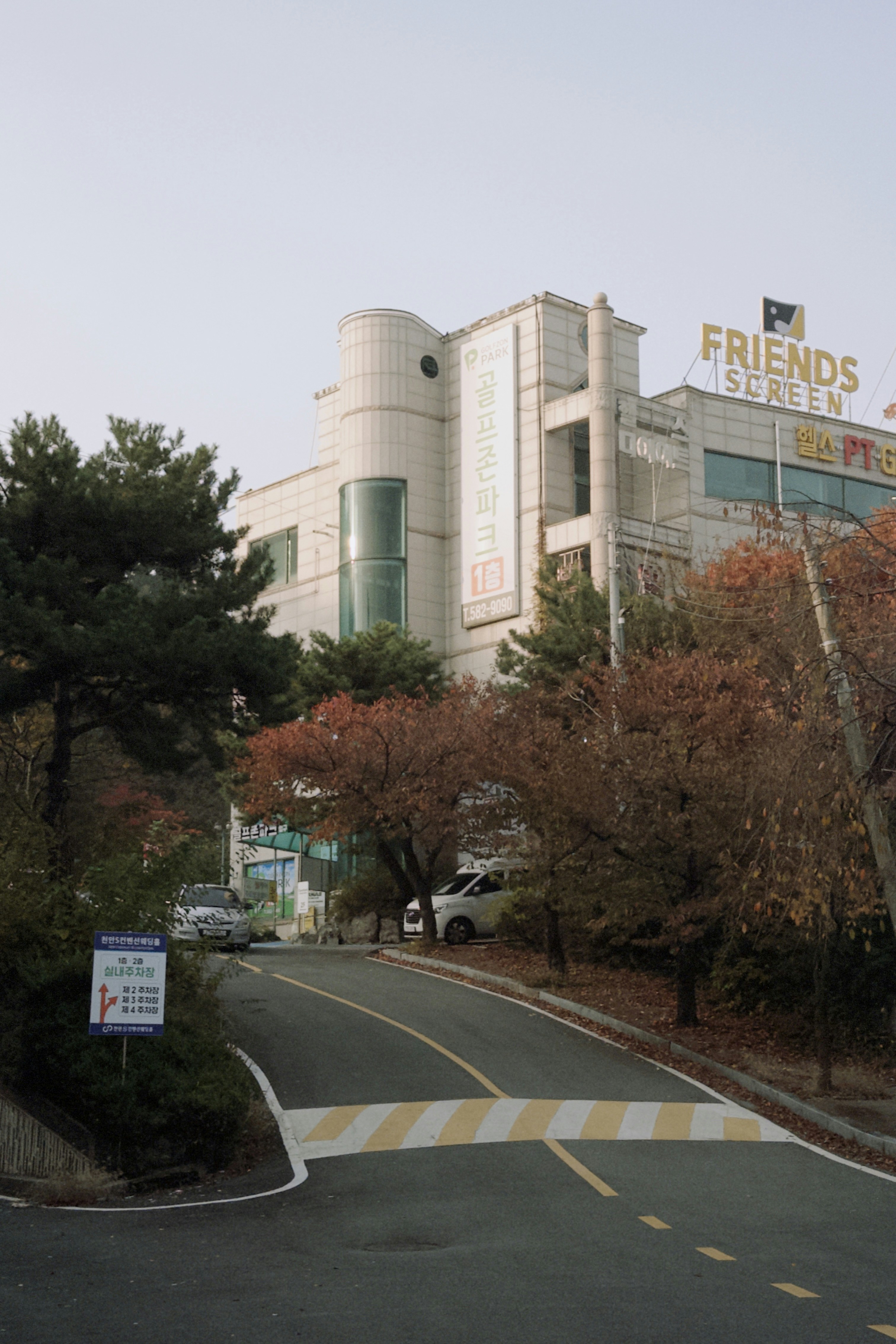 A group of friends laughing and socializing on a golf course.
