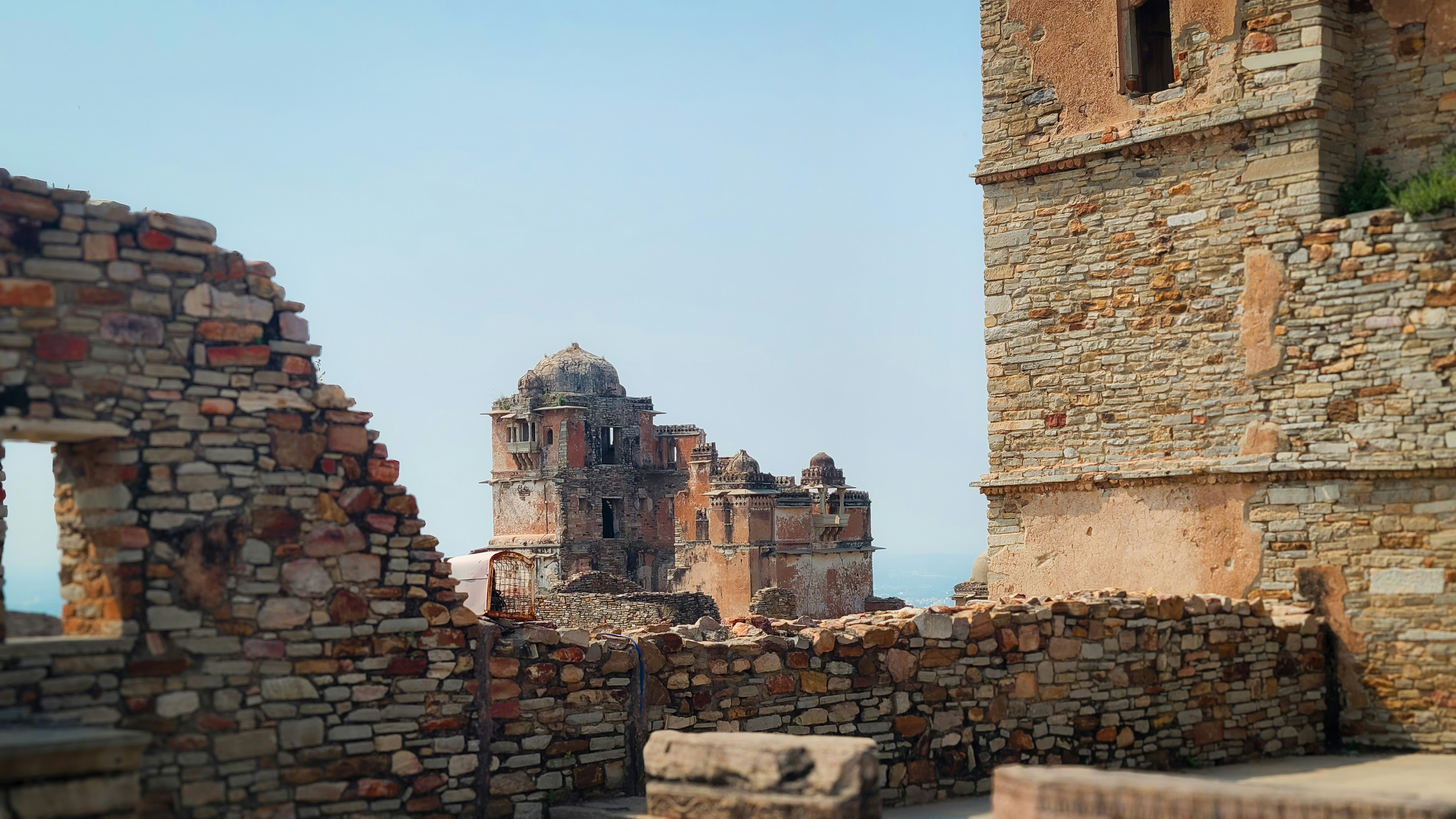 Ancient stone ruins of a fort under a clear sky