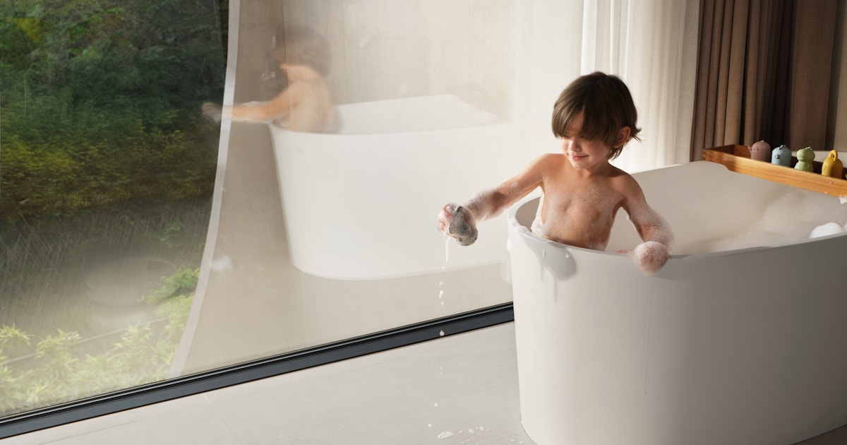 Dreame robot mop and vacuum combo is cleaning near a bathtub, emphasizing daily family convenience. by Robot Instructions Child playing in bathtub with robot vacuum cleaner