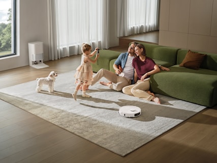 Family and dog relaxing on living room floor