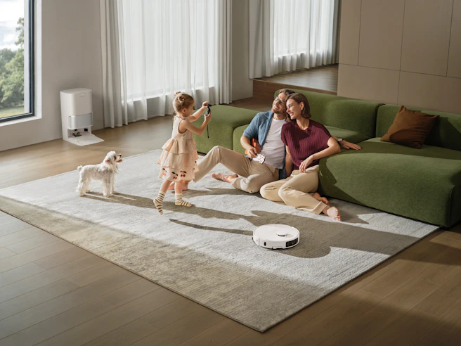 Family and dog relaxing on living room floor