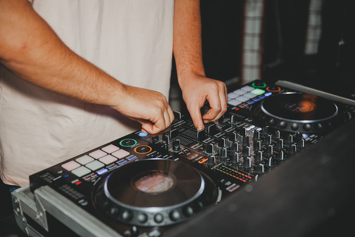 Professional DJ mixing on a console