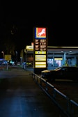 Gas station sign with prices at night