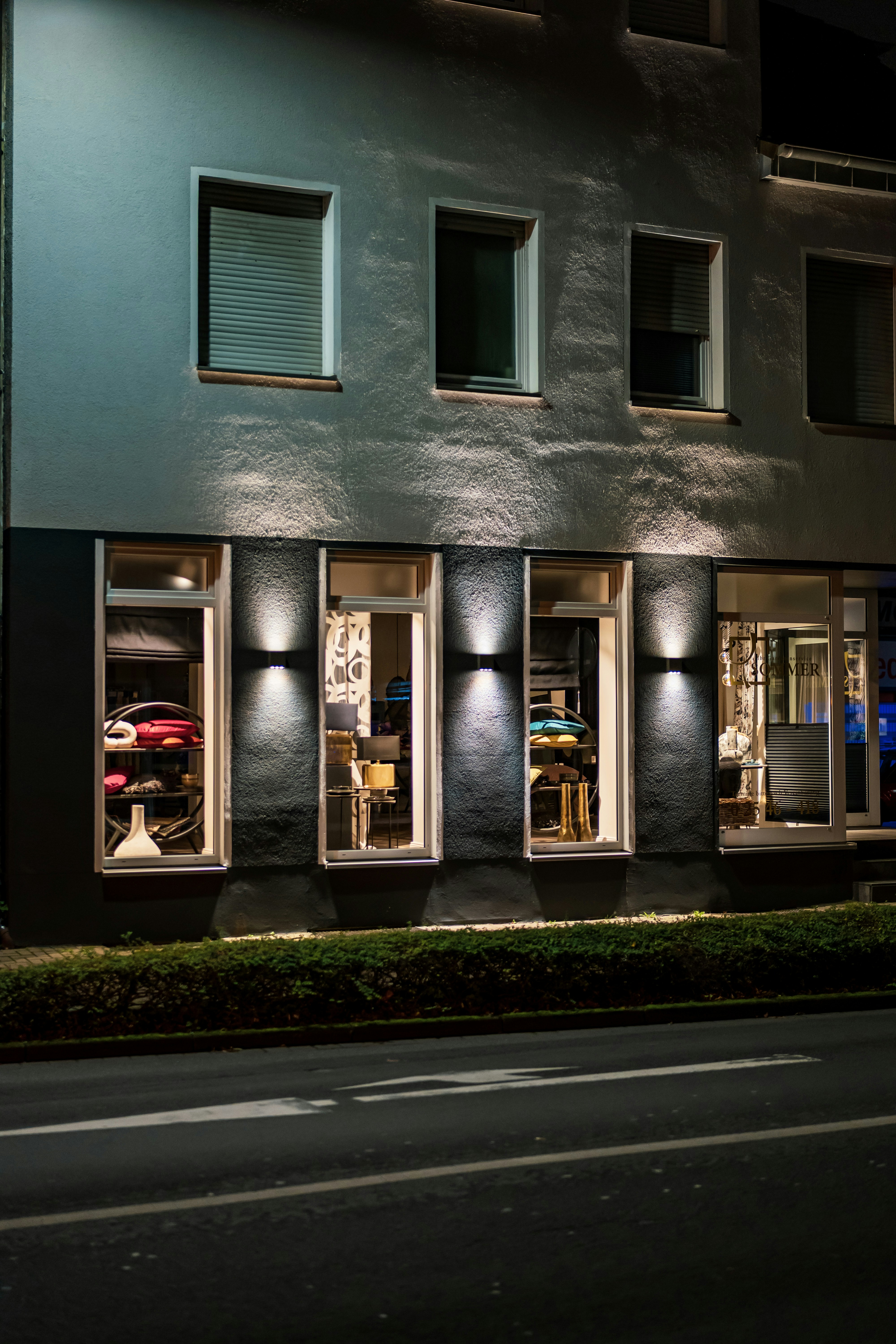 Building facade with illuminated windows at night