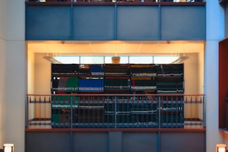 Rows of colorful books on shelves in a library