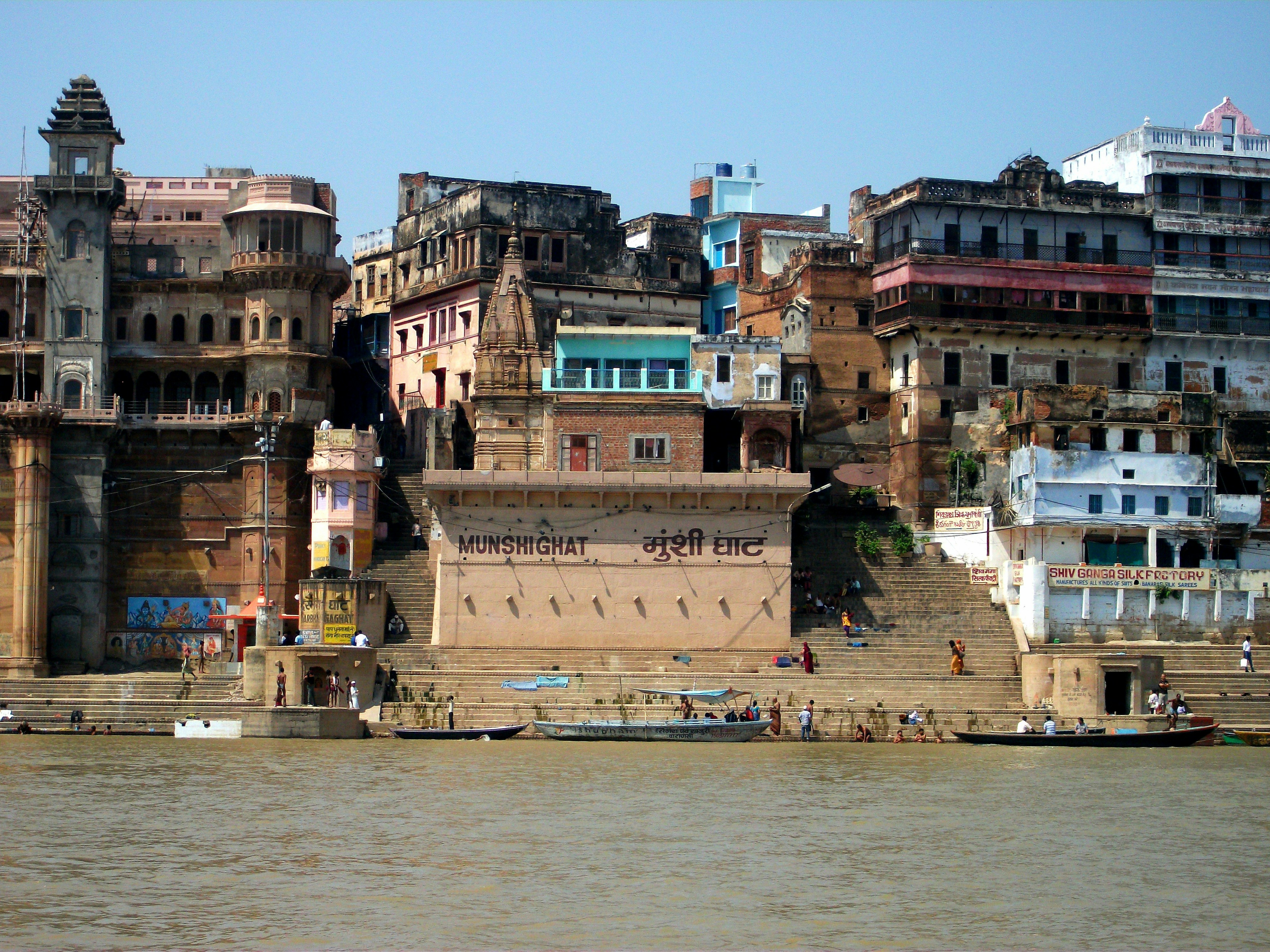 Buildings line the ganges river in india.