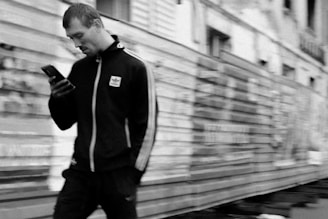 Man looking at phone in front of trailer