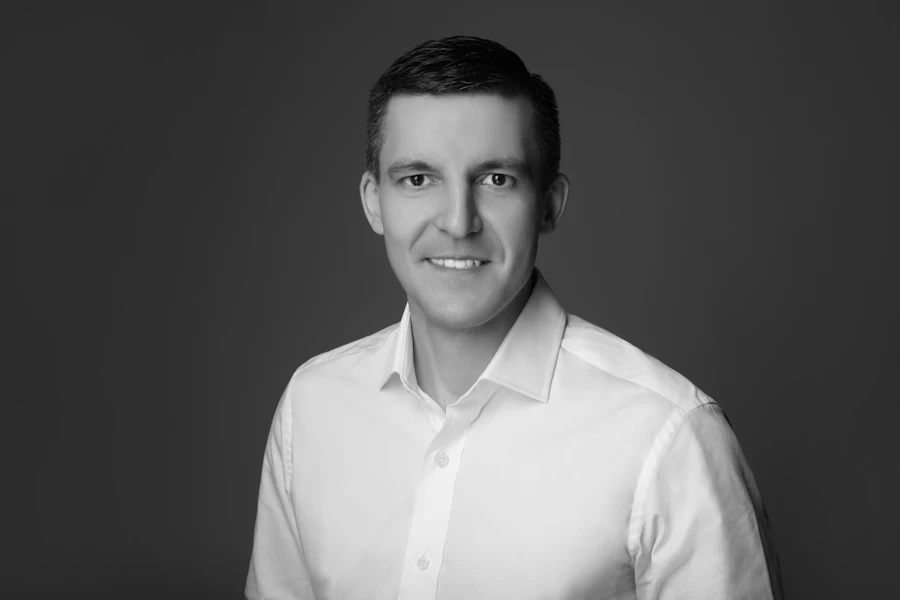 Friendly professional man in a white collared shirt