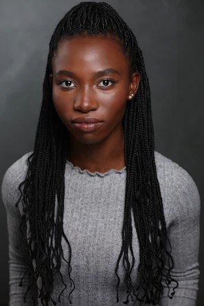 A young black woman with braided hair