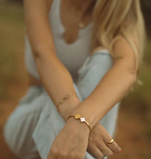 Woman wearing a bracelet and rings