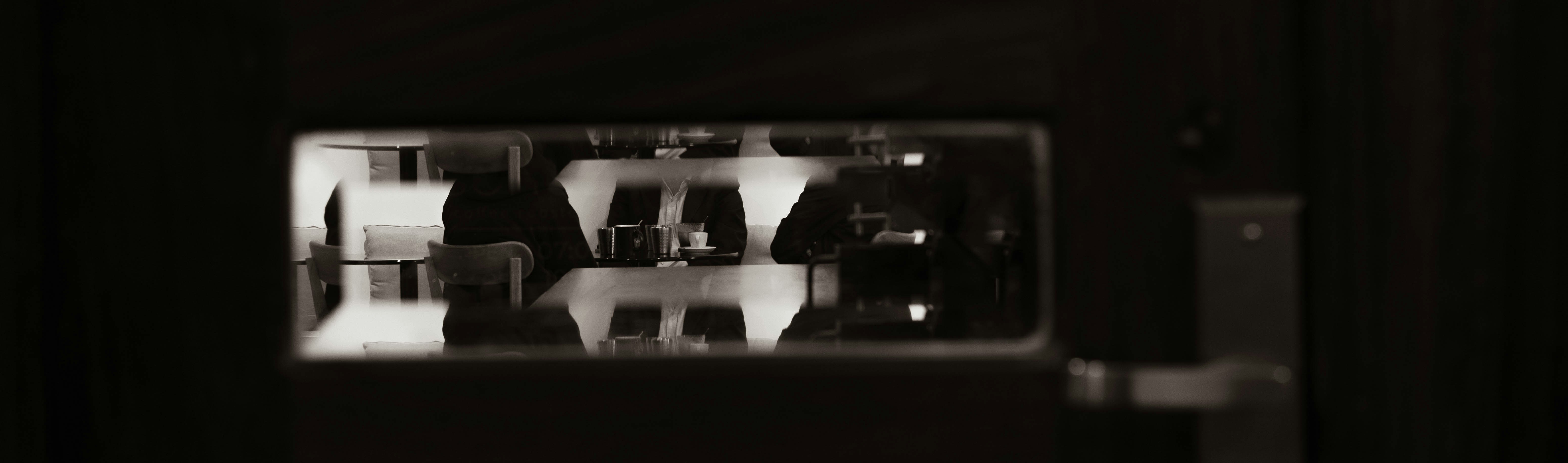 Abstract dark background with a rectangular illuminated panel.