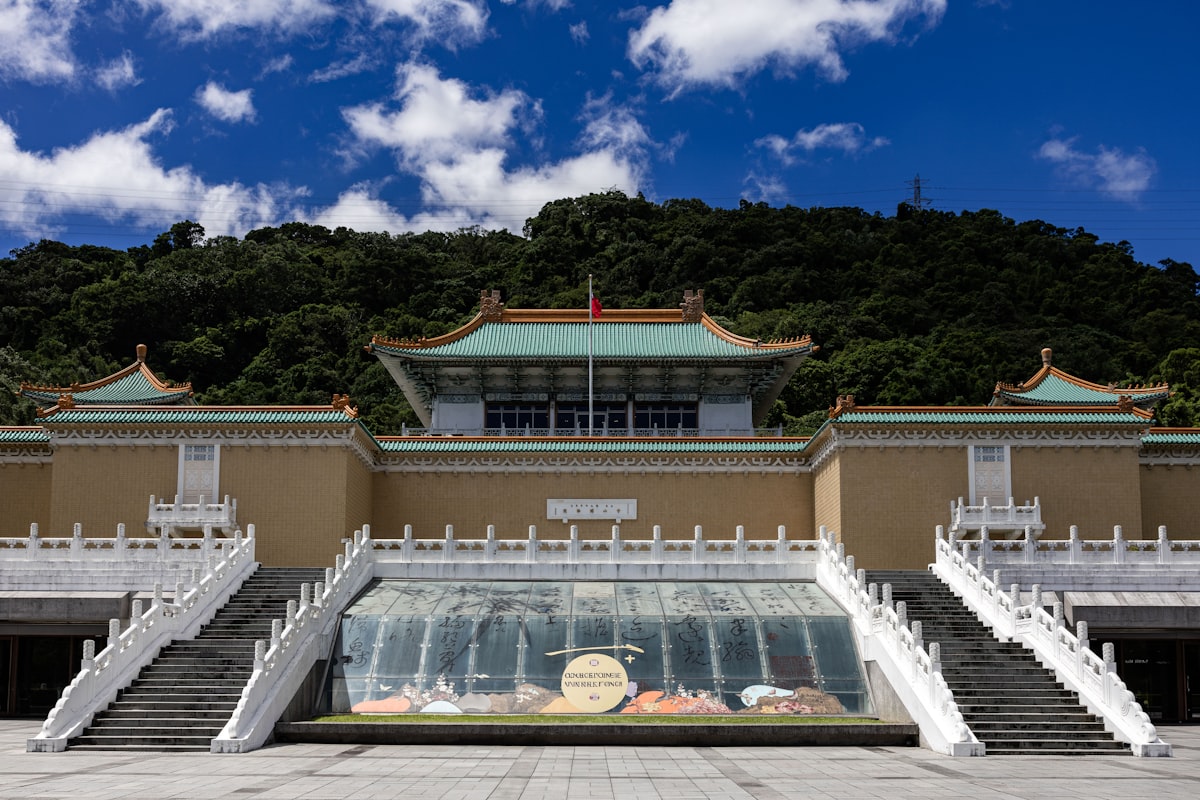National Palace Museum with lush green hill backdrop