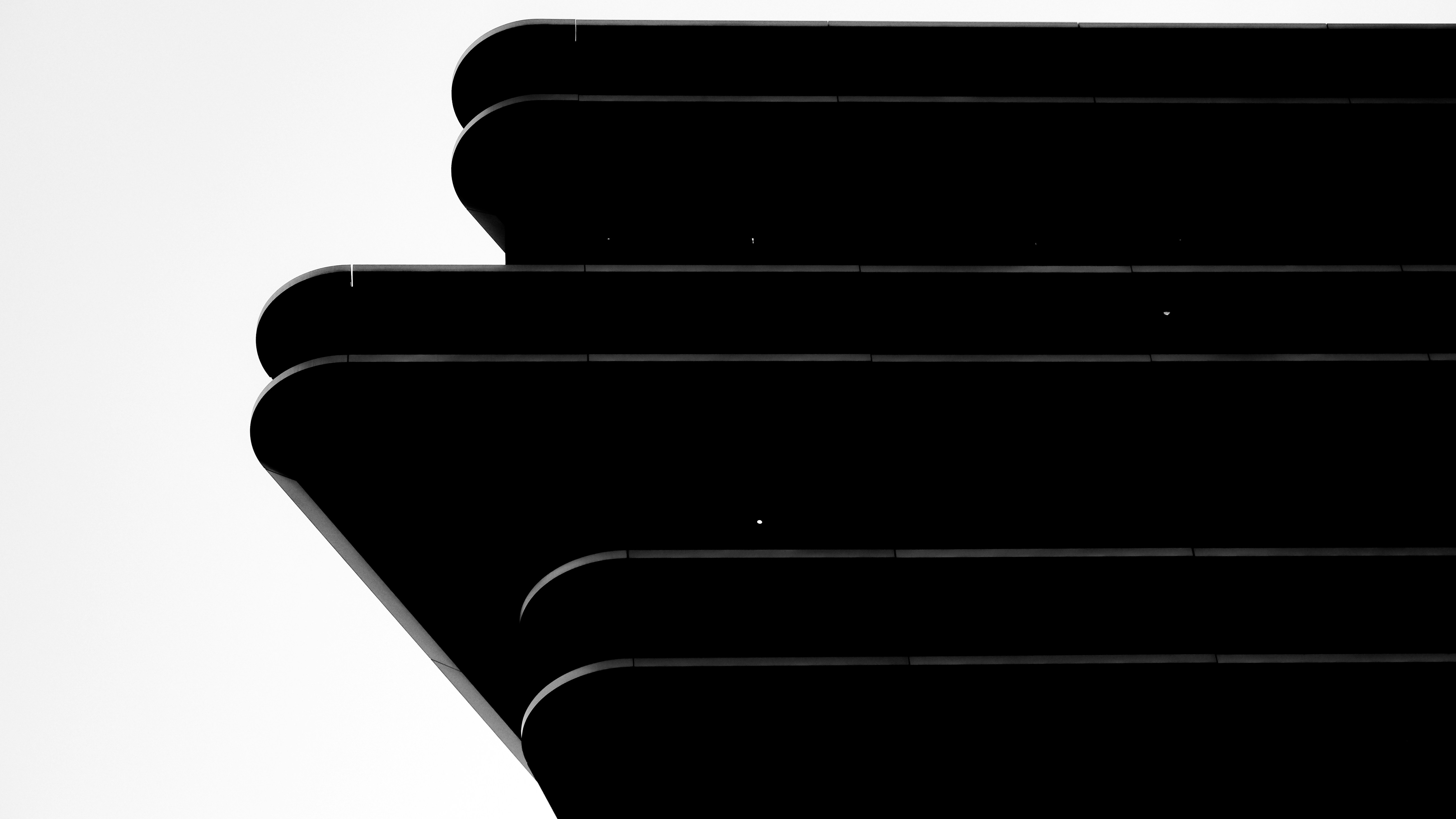 Abstract black layers against a white background