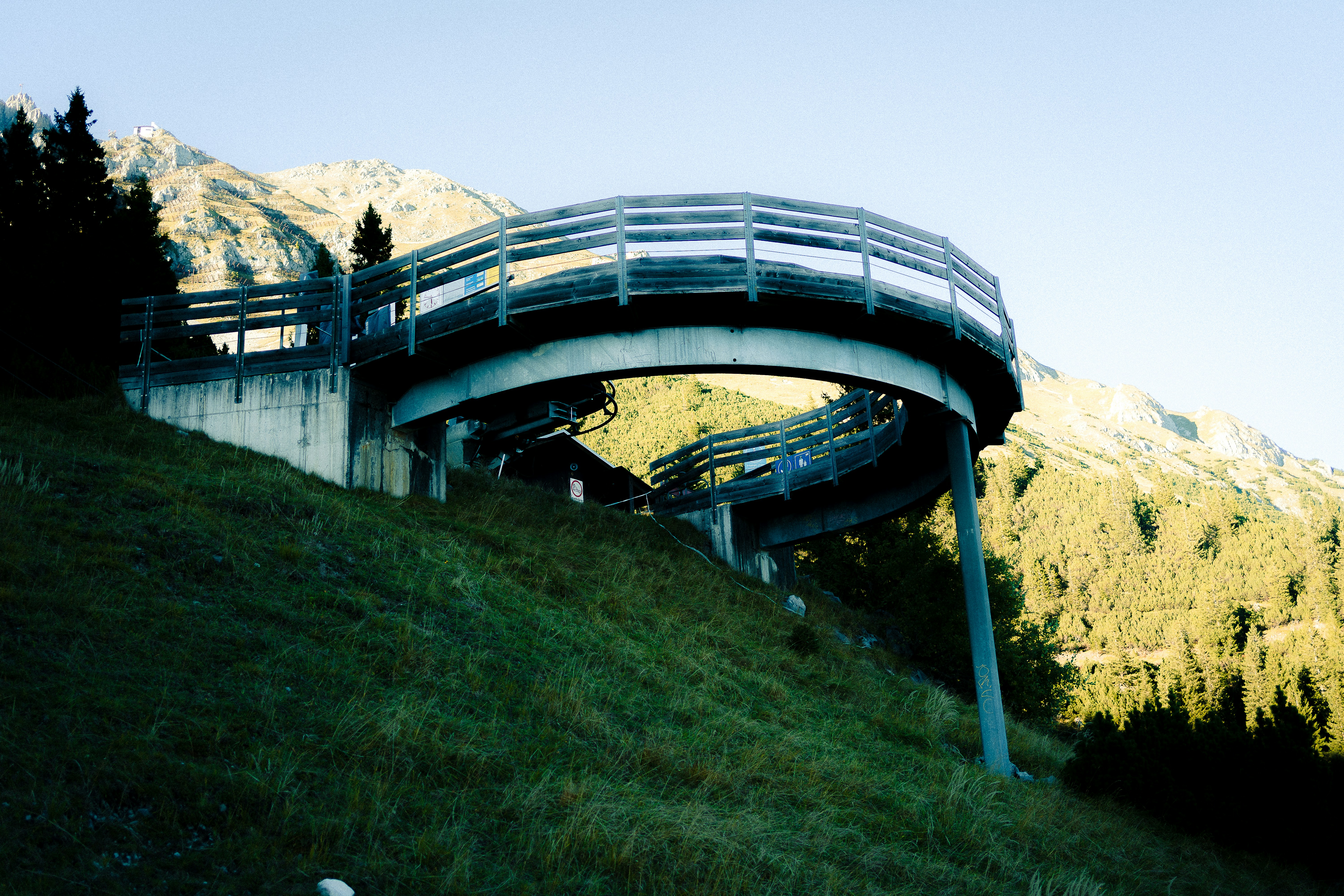 Modern viewing platform on a grassy hillside