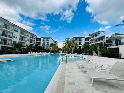 Modern resort with large swimming pool and lounge chairs