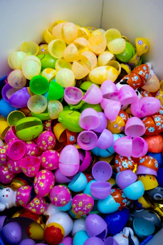 A pile of colorful plastic easter eggs.