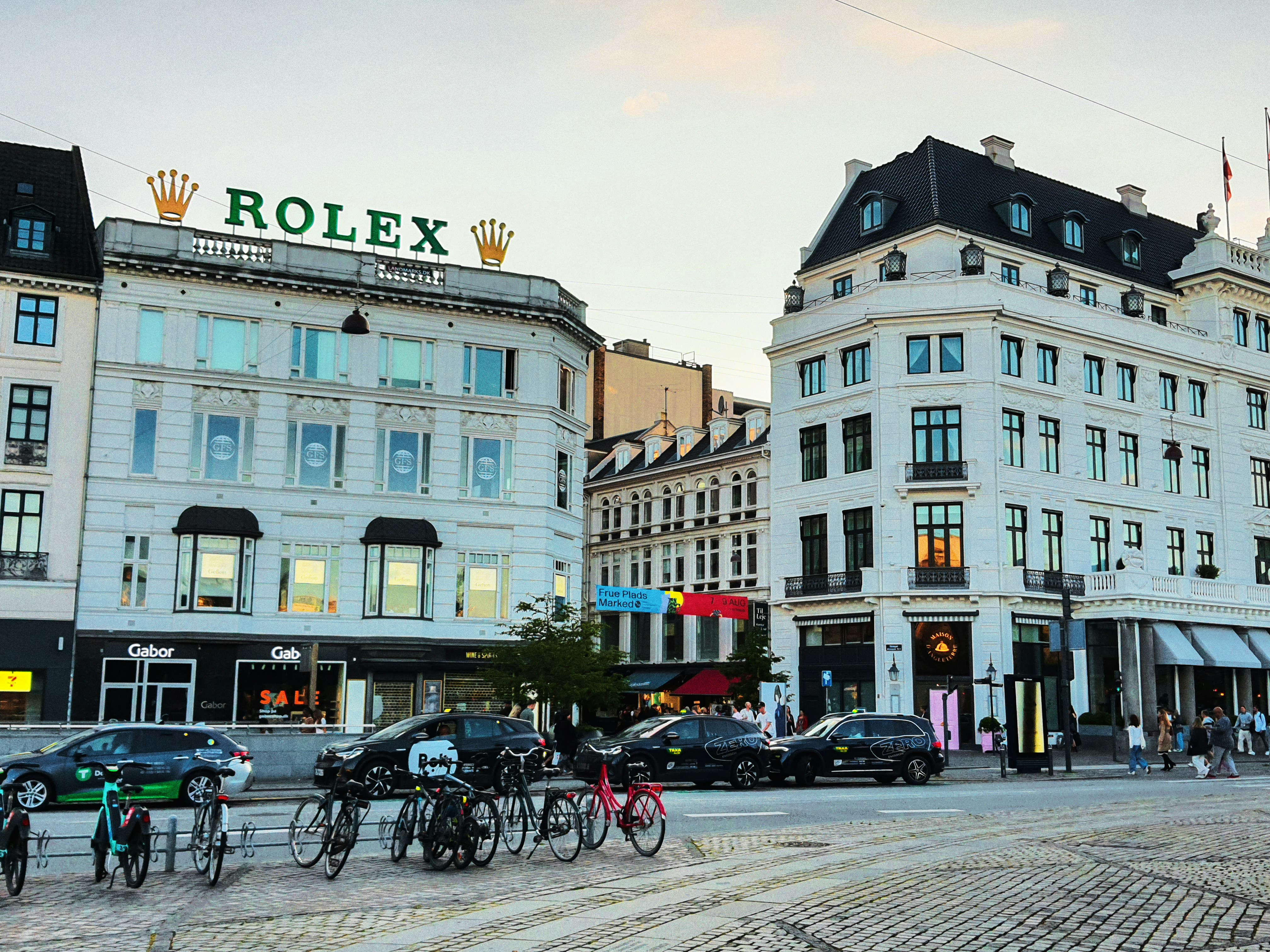City street with rolex sign and buildings