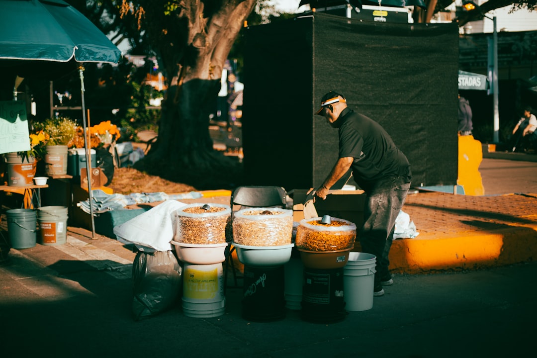 Man selling food from a street cart.