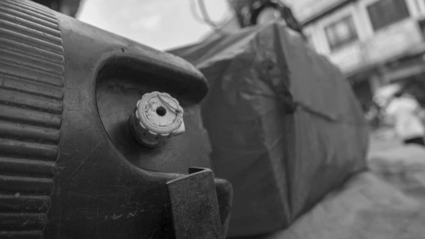 Close-up of a gas container valve and connection point