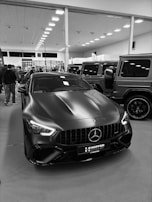 Matte black mercedes-benz gt sedan on display