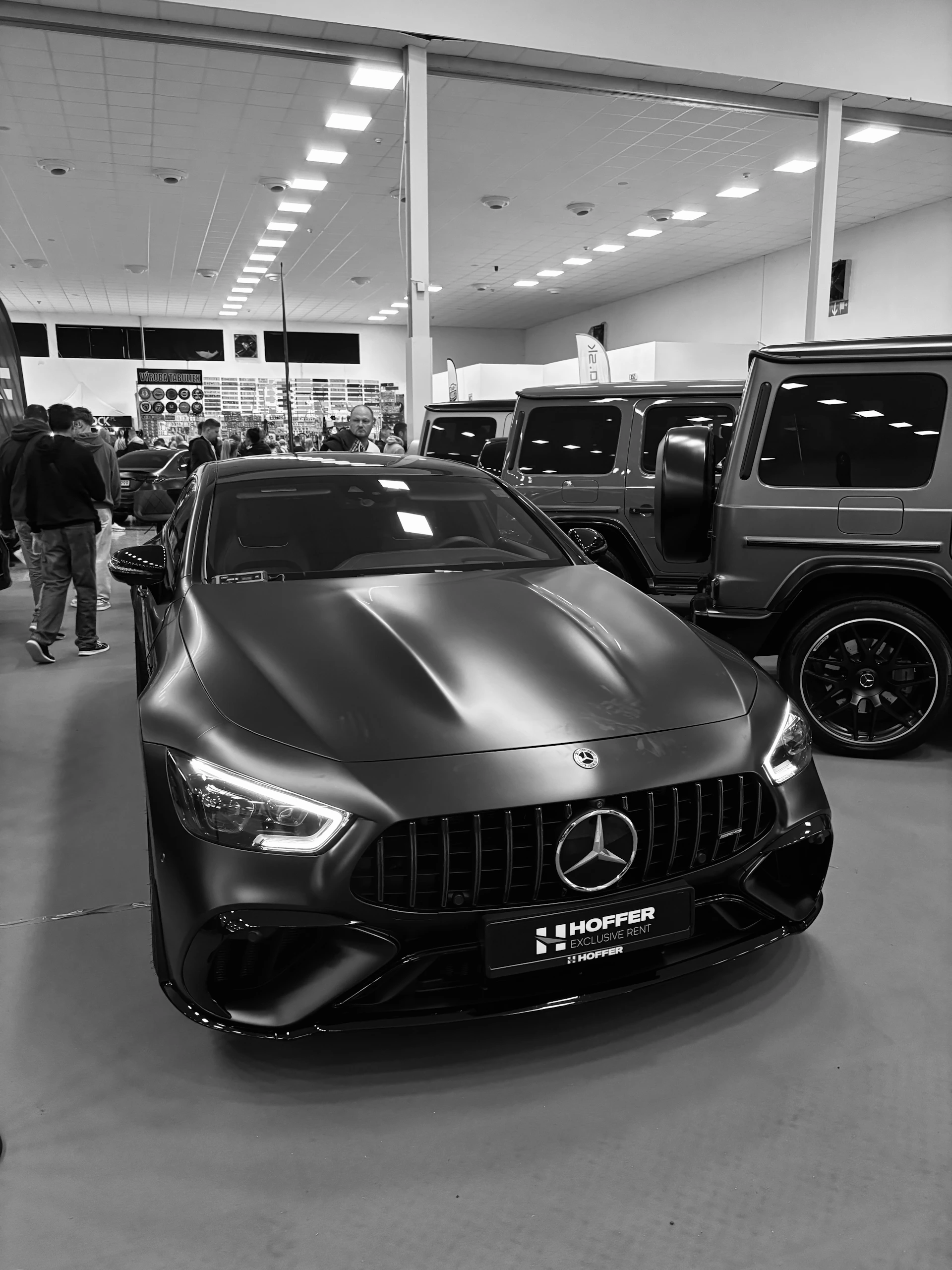 Matte black mercedes-benz gt sedan on display