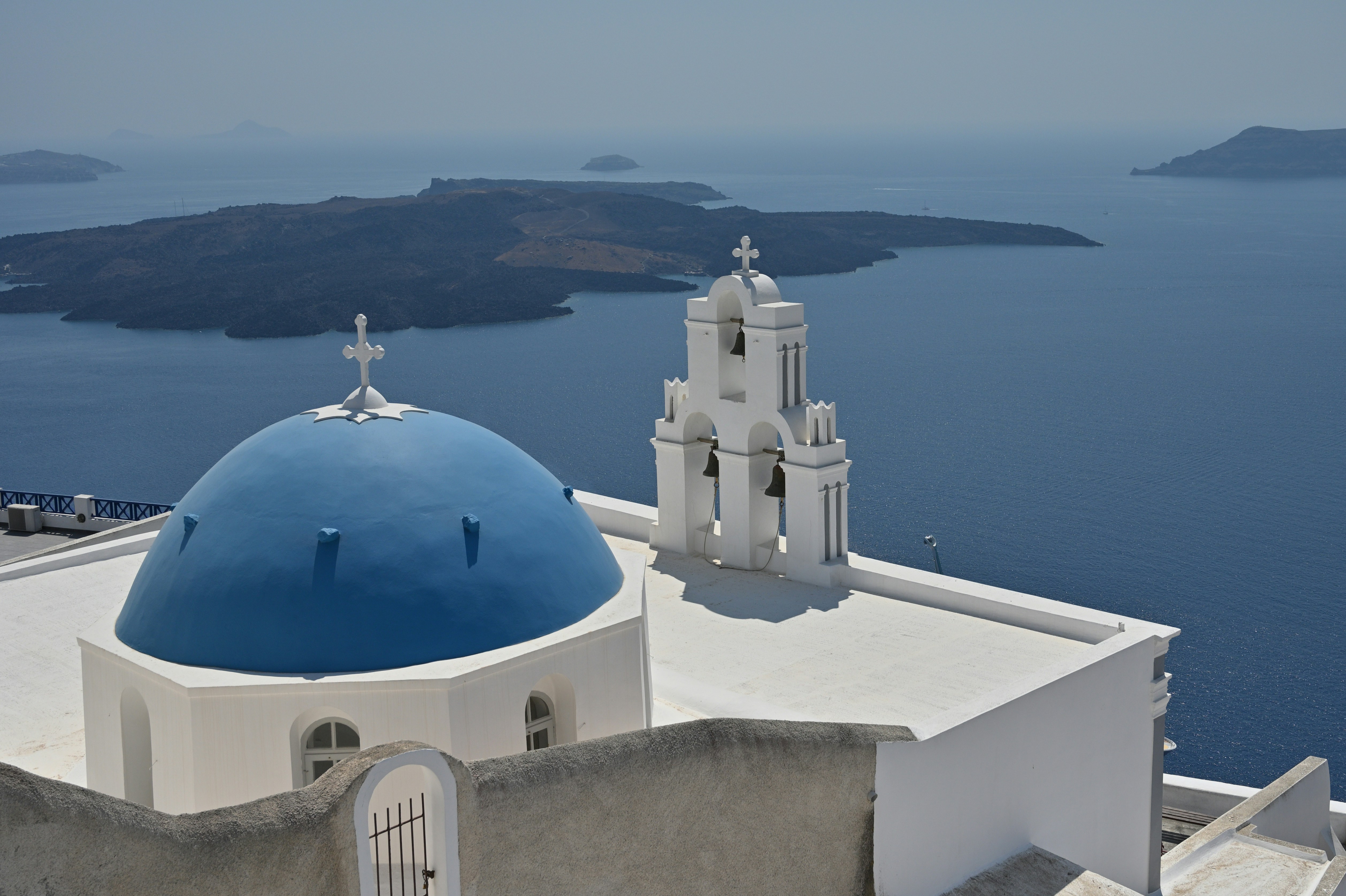 Blue domed church overlooking the sea