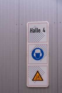 Sign for hall 4 with safety warnings
