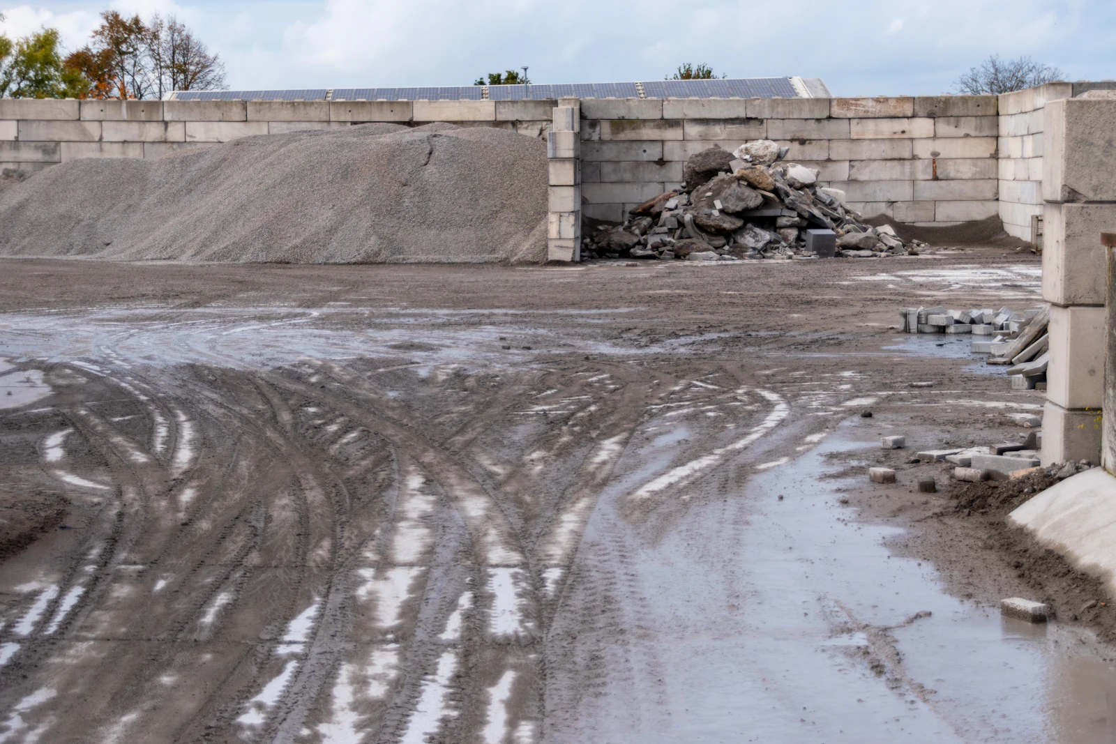 Piles of crushed stone and gravel at a construction site